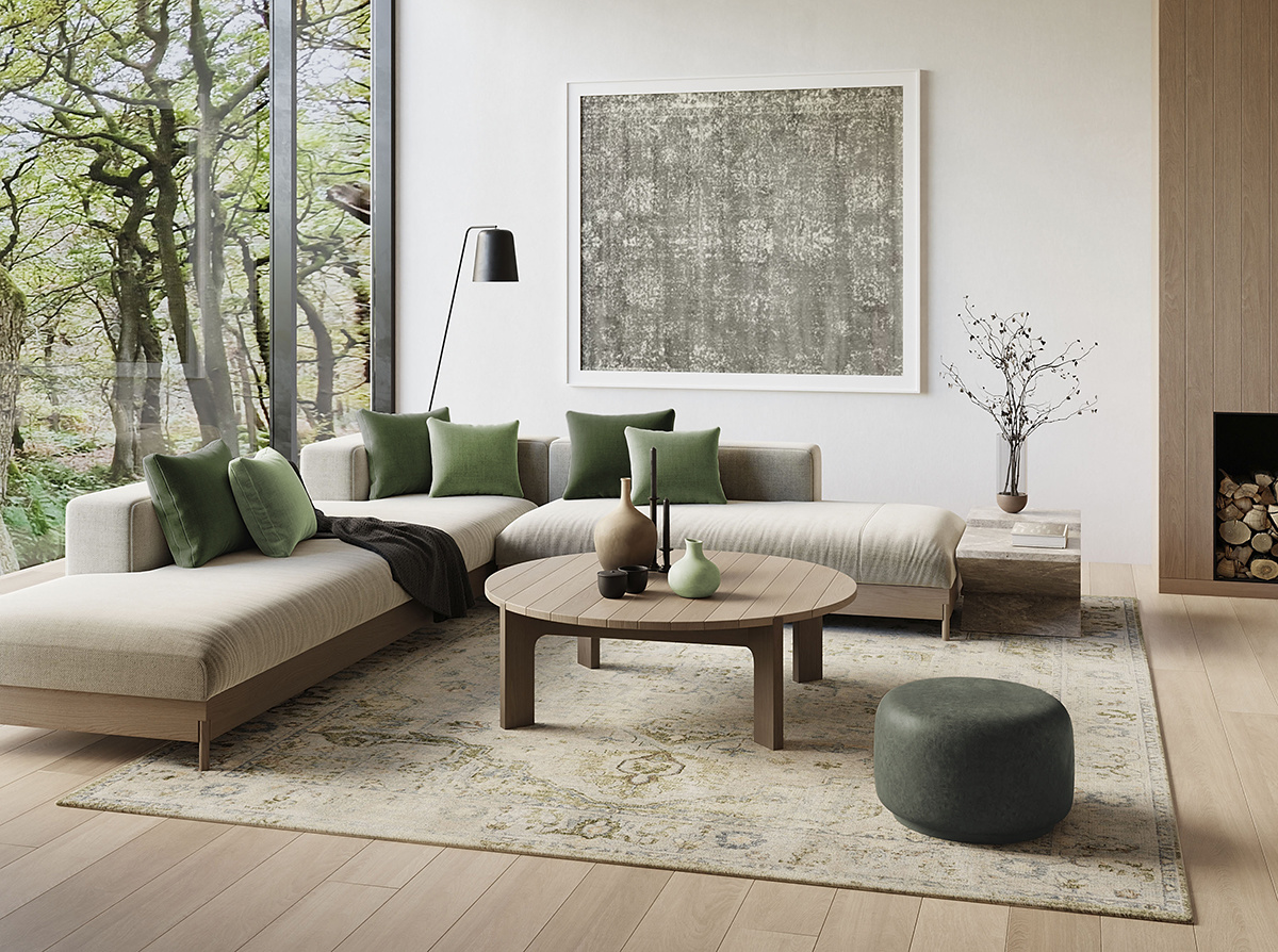 Living room with green pillows, poufs, and a vintage-style Persian green and beige rug