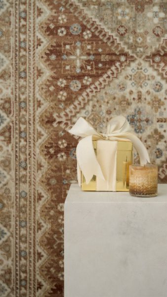 Cocktail on a plinth in front of a Persian-inspired rug