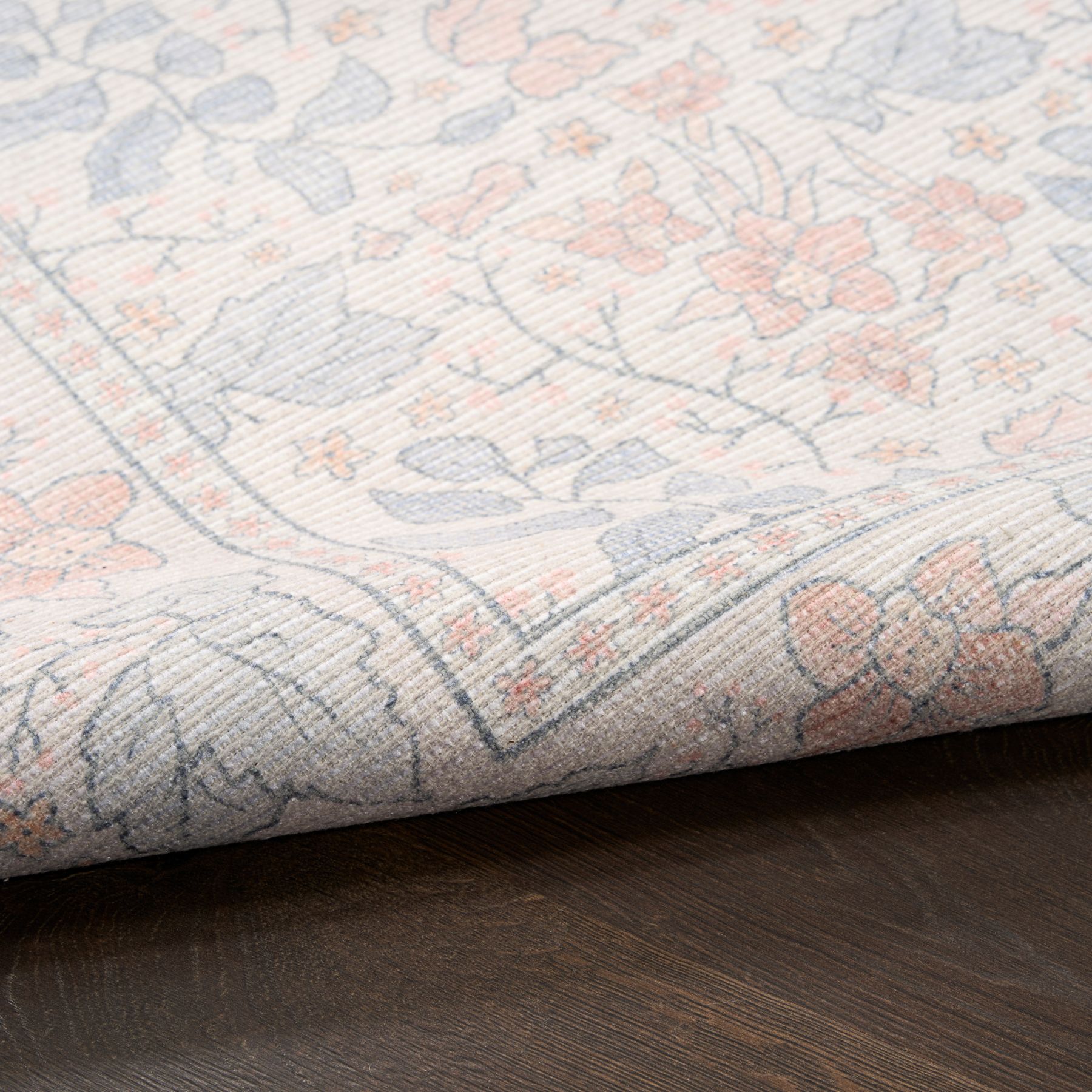 Closeup view of Botanical Washables BOT03 floral cotton-blend rug in ivory