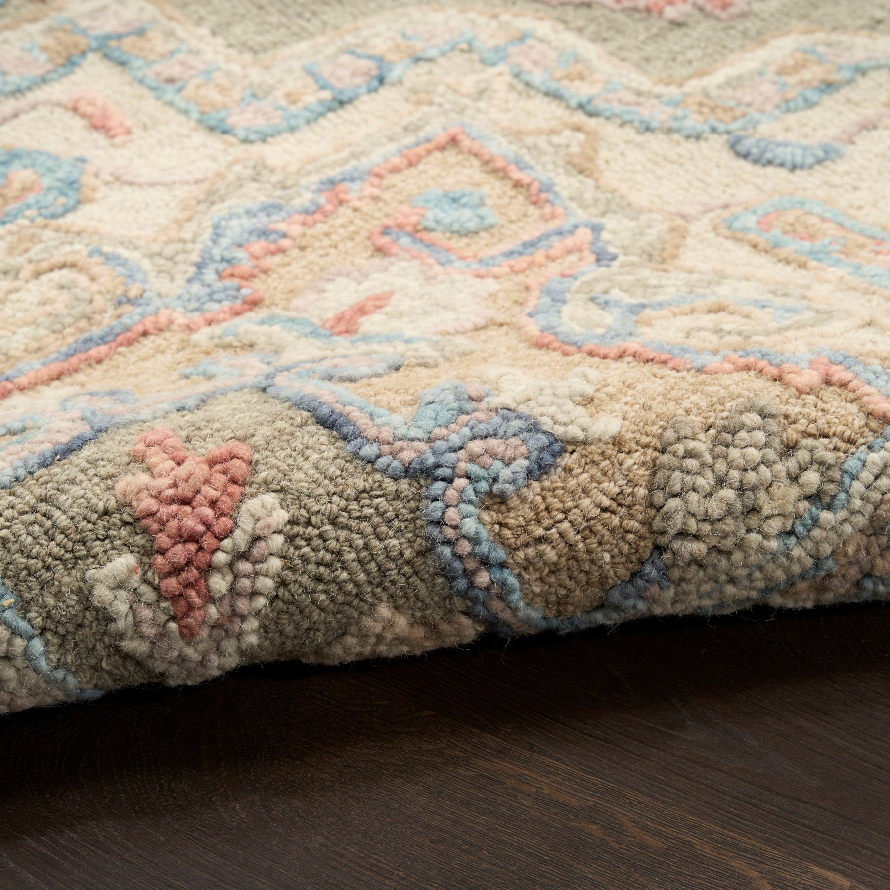 Closeup view of Maison MSO06 Persian-inspired wool rug in Muted Green