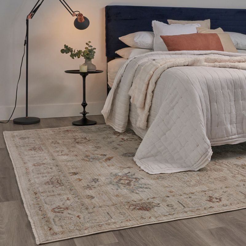 Bedroom with a vintage-inspired rug and soft lighting